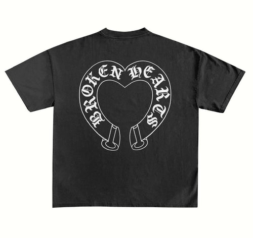 Back of a washed black Broken Hearts oversized tee with jumbo white horseshoe heart print in Old English lettering